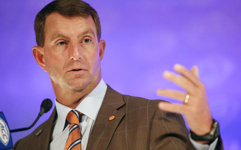 Clemson head coach Dabo Swinney answers a question during ACC Kickoff media days on Thursday in Charlotte, N.C. (NELL REDMOND/Associated Press)