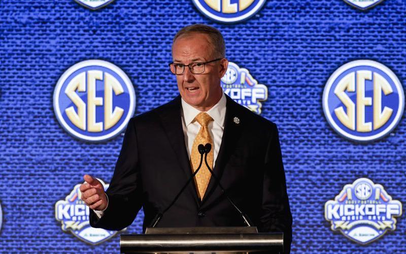 SEC Commissioner Greg Sankey speaks to reporters during SEC Media Days on July 19 in Hoover, Ala. (BUTCH DILL/Associated Press)