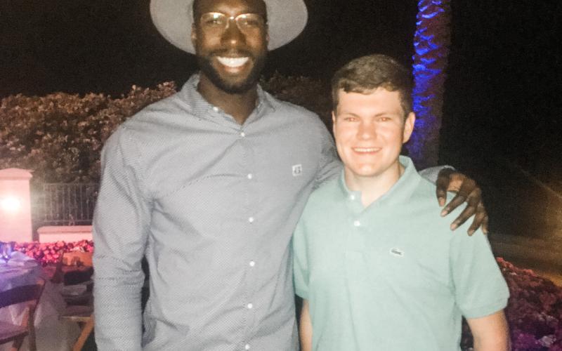 Eli Stewart (right) poses with former Gators basketball star Patric Young during the Tom Coughlin Jay Fund Celebrity Golf Classic in May. (COURTESY)