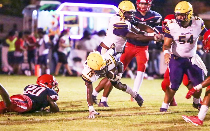 Columbia running back Leo Robinson stumbles to the ground on a carry during Friday's Preseason Classic against Vanguard. (BRENT KUYKENDALL/Lake City Reporter)