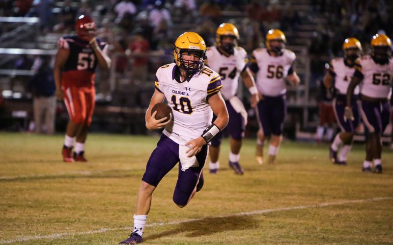 Columbia quarterback Kade Jackson finds running room Friday at Vanguard. (BRENT KUYKENDALL/Lake City Reporter)