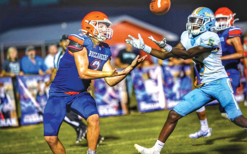 Branford slot receiver Caden Coker (left) battles a Chiefland defender for a pass Friday night. (BRIAN LEWIS/Special to the Reporter)