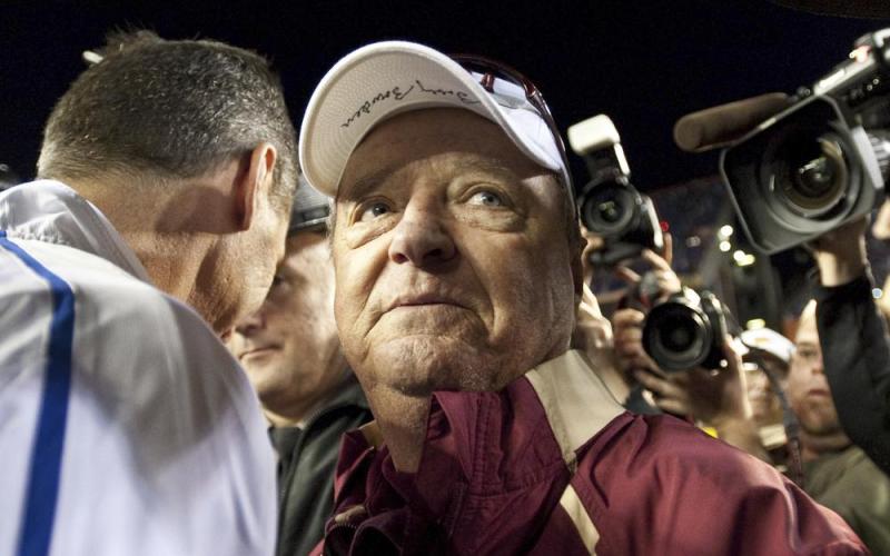 Florida State head football coach Bobby Bowden wears a dejected expression as he turns to leave Florida coach Urban Meyer after congratulating Meyer following Florida's 37-10 win over Florida State on Nov. 28, 2009, in Gainesville. Bowden died Sunday after a battle with pancreatic cancer. (AP FILE)