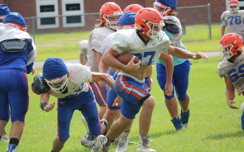 Branford running back Bodhi White turns up the field during practice on Aug. 13. (JAMIE WACHTER/Lake City Reporter)