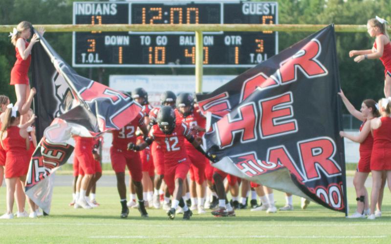 Fort White receiver Najeeb Smith leads his team on the field prior to last week's Preseason Classic against Middleburg. (CHRISTINA FEAGIN/Special to the Reporter)
