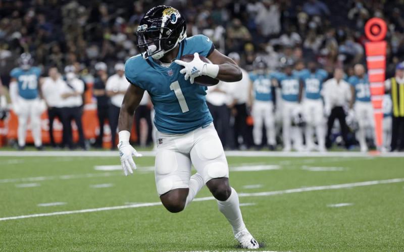 Jacksonville Jaguars running back Travis Etienne (1) carries in the first half of Monday's preseason game in New Orleans. (DERICK HINGLE/Associated Press)