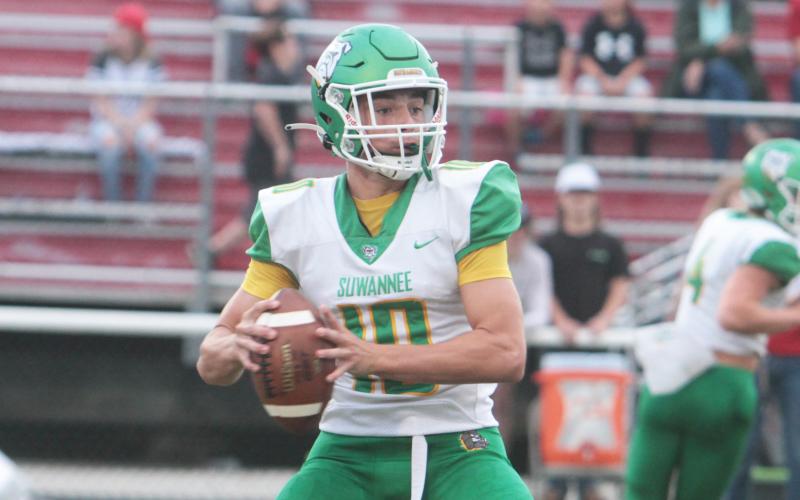 Suwannee quarterback Kodi Lang drops back to pass against Dixie County on Friday. (PAUL BUCHANAN/Special to the Reporter)