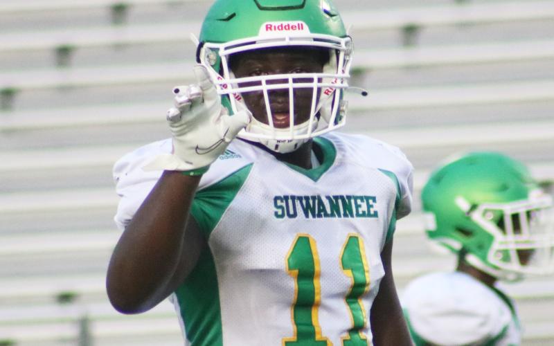 Suwannee linebacker Andrew Brown calls out a play to his defense during a team scrimmage on Saturday. (JAMIE WACHTER/Lake City Reporter)