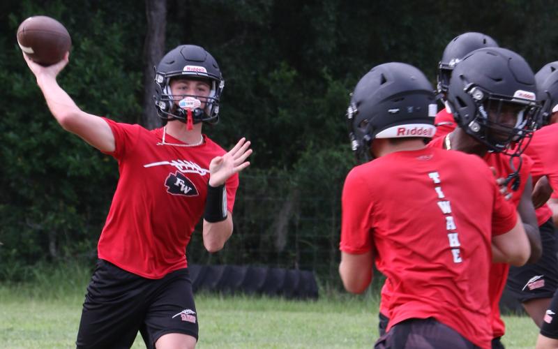 Fort White quarterback Clayton Philpot throws a pass during practice on Thursday. (MORGAN MCMULLEN/Lake City Reporter)