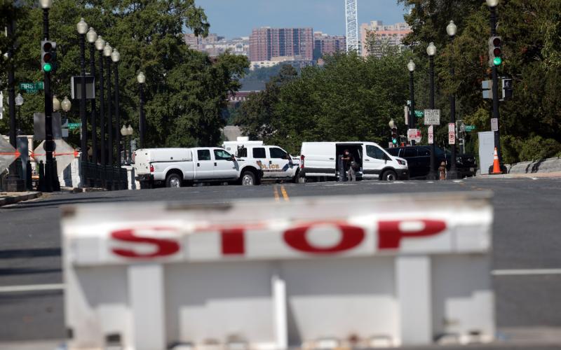First responders arrive on the scene to investigate a report of an explosive device in a pickup truck near the Library of Congress on Capitol Hill on Thursday in Washington, D.C. The suspect has since surrendered and has been arrested after the area was evacuated. (WIN MCNAMEE/Getty Images/TNS)