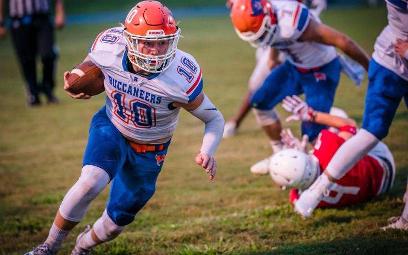 Branford quarterback Kyson Johnson scrambles up the field against Williston on Aug. 27. (BRIAN LEWIS/Special to the Reporter)