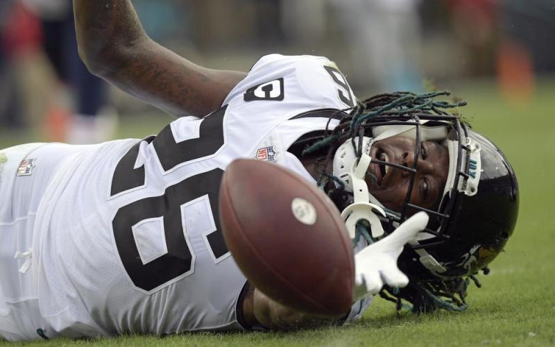 Jacksonville Jaguars cornerback Shaquill Griffin (26) can't quite hang on to a possible interception against the Denver Broncos on Sept. 19 in Jacksonville. (PHELAN M. EBENHACK/Associated Press)