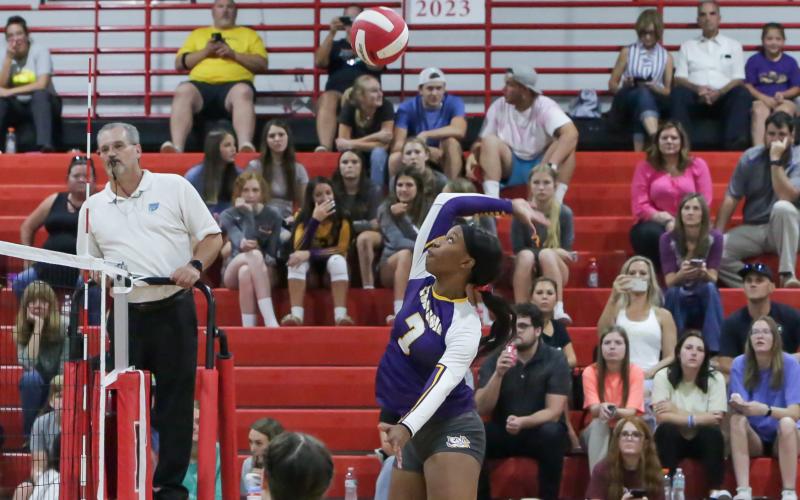 Columbia middle blocker Brandi Oliver sends a shot over the net against Fort White on Thursday night. Oliver finished with a team-high seven kills. (BRENT KUYKENDALL/Lake City Reporter)