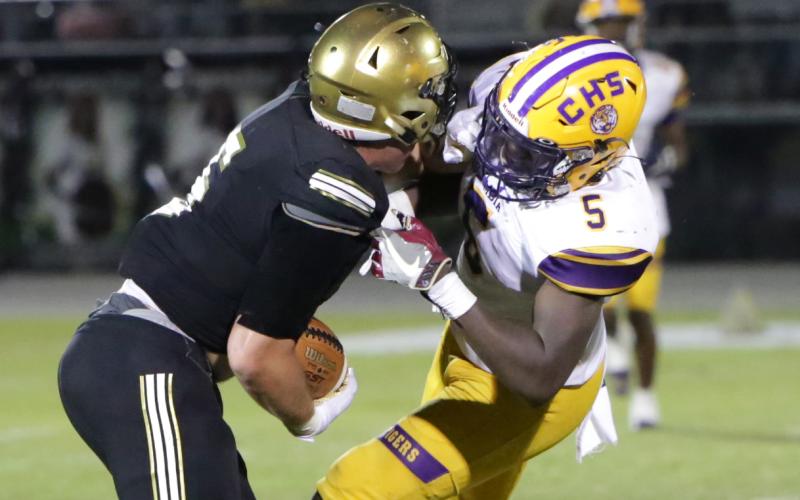 Columbia linebacker Jaden Robinson makes a tackle against Oakleaf on Sept. 10. (BRENT KUYKENDALL/Lake City Reporter)