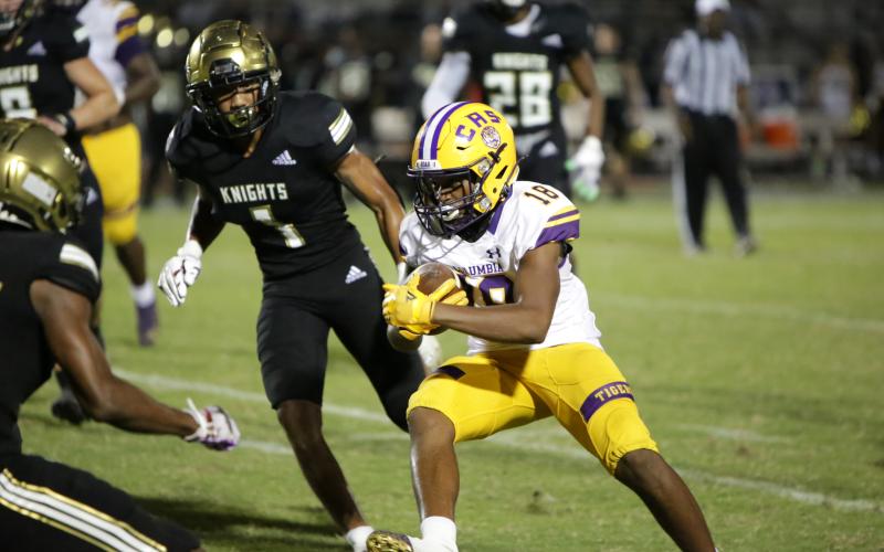 Columbia receiver Keeven Young runs up the field after a catch against Oakleaf on Sept. 10. (BRENT KUYKENDALL/Lake City Reporter)
