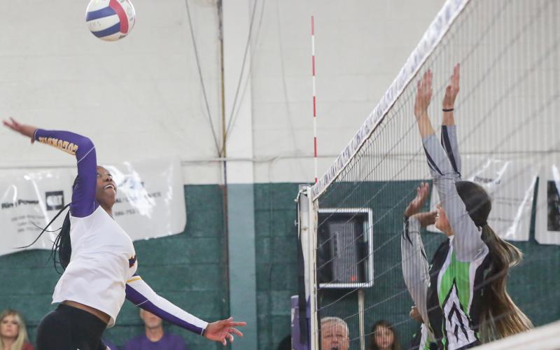 Columbia’s Brandi Oliver sends a shot over the net against Suwannee on Tuesday night. (BRENT KUYKENDALL/Lake City Reporter)