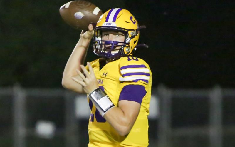 Columbia quarterback Kade Jackson drops back to pass against Trinity Christian on Sept. 24 (BRENT KUYKENDALL/Lake City Reporter)