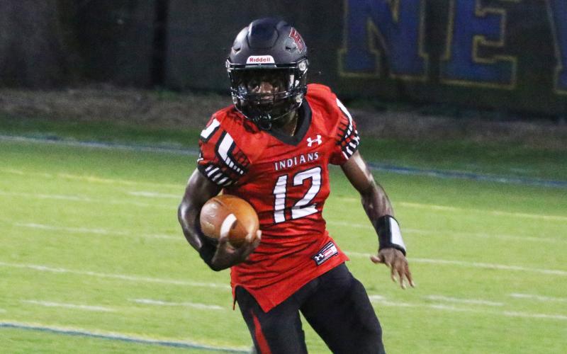 Fort White receiver Najeeb Smith rushes up the field against Newberry on Sept. 3. (MORGAN MCMULLEN/Lake City Reporter)