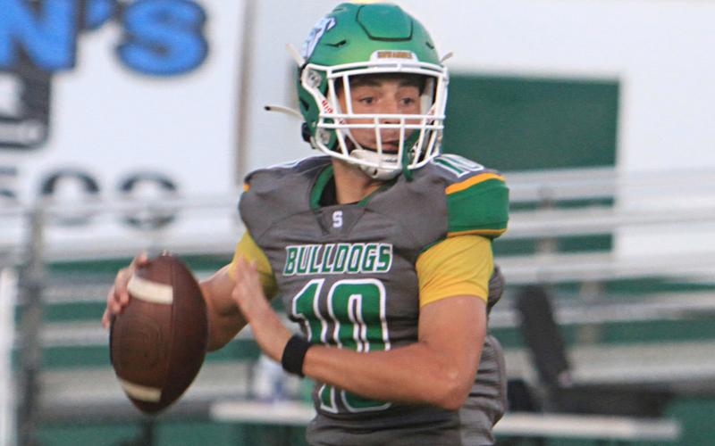 Suwannee quarterback Kodi Lang sets to throw a pass against Westside on Friday night. (PAUL BUCHANAN/Special to the Reporter)