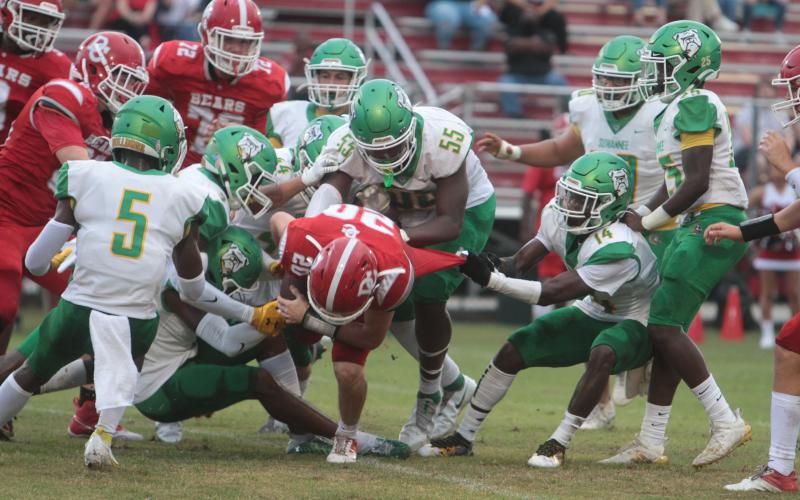 Suwannee safety Trevion Milton tackles Dixie County running back Bryar Mitchell on Aug. 27. (PAUL BUCHANAN/Special to the Reporter)