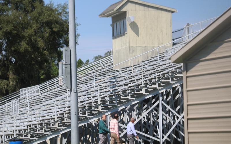 Lake City Growth Management Director David Young (left) tours the facility at Memorial Stadium Monday afternoon. (TONY BRITT/Lake City Reporter)