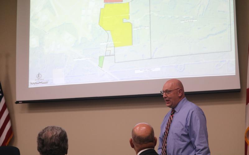 Florida Gateway College President Lawrence Barrett discusses concerns the college has with Lake City and Columbia County officials in a joint meeting Tuesday. (TONY BRITT/Lake City Reporter)