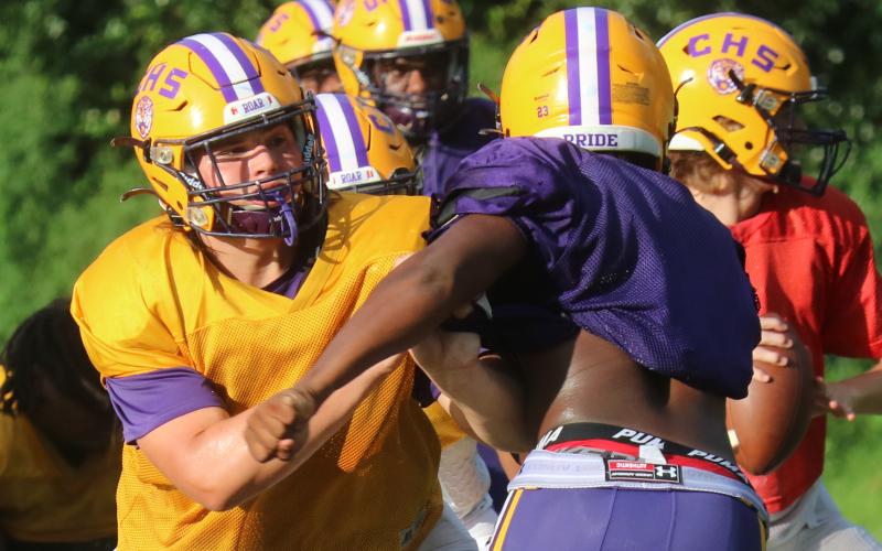 Columbia offensive lineman Caleb Pope blocks during practice on Tuesday. (JORDAN KROEGER/Lake City Reporter)