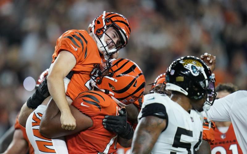 Cincinnati Bengals kicker Evan McPherson, left, celebrates after kicking the game-winning field goal against the Jacksonville Jaguars on Thursday in Cincinnati. Cincinnati won 24-21. (MICHAEL CONROY/Associated Press)