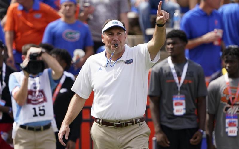Florida head coach Dan Mullen directs player warmups before a game against Alabama on Sept. 18 in Gainesville. (JOHN RAOUX/Associated Press)
