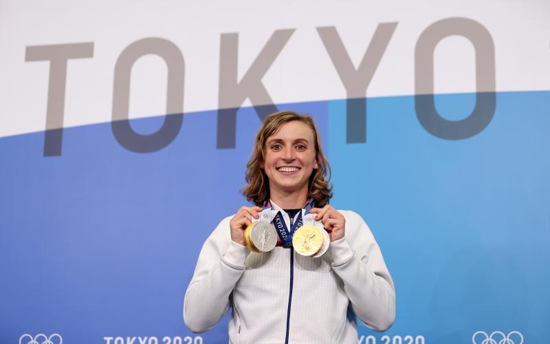 Katie Ledecky displays her two Gold and two Silver medals after a news conference during the Tokyo Olympic Games on July 31 in Tokyo. (LAURENCE GRIFFITHS/Getty Images/TNS)