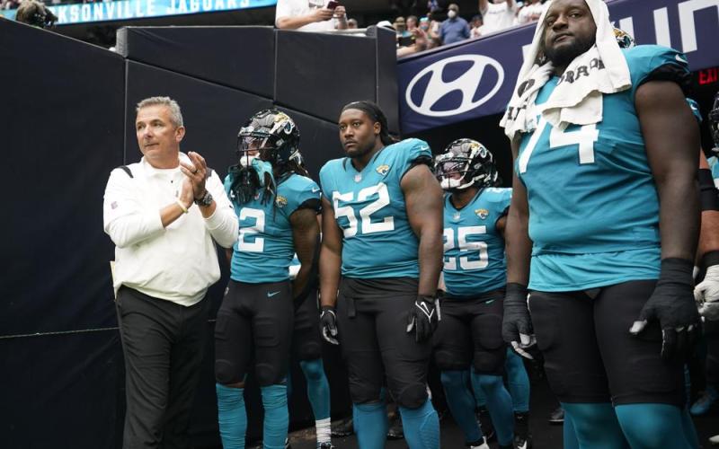 Jacksonville Jaguars coach Urban Meyer, left, prepares to lead his team onto the field before a game against the Houston Texans on Sept. 12 in Houston. (SAM CRAFT/Associated Press)