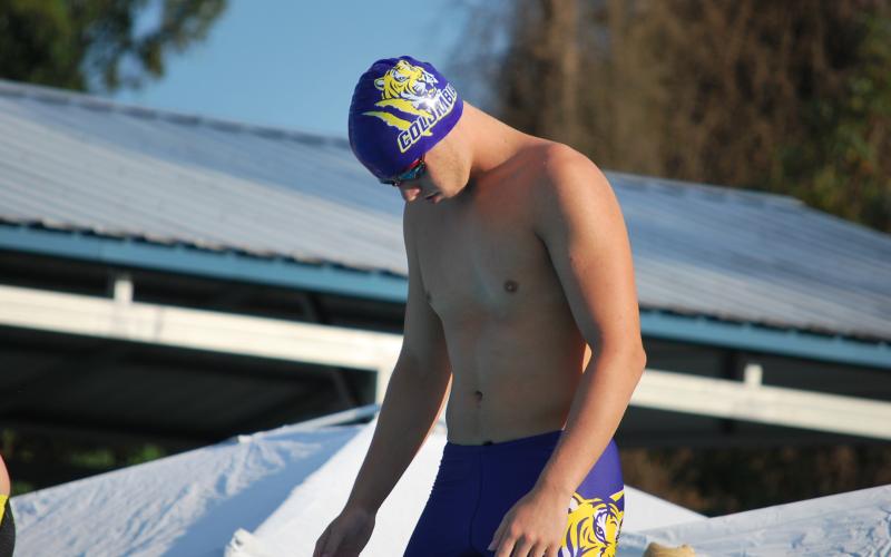 Columbia swimmer Jayden Drew gets ready on the block prior to swimming the 50 freestyle against Yulee on Tuesday. (COURTESY)