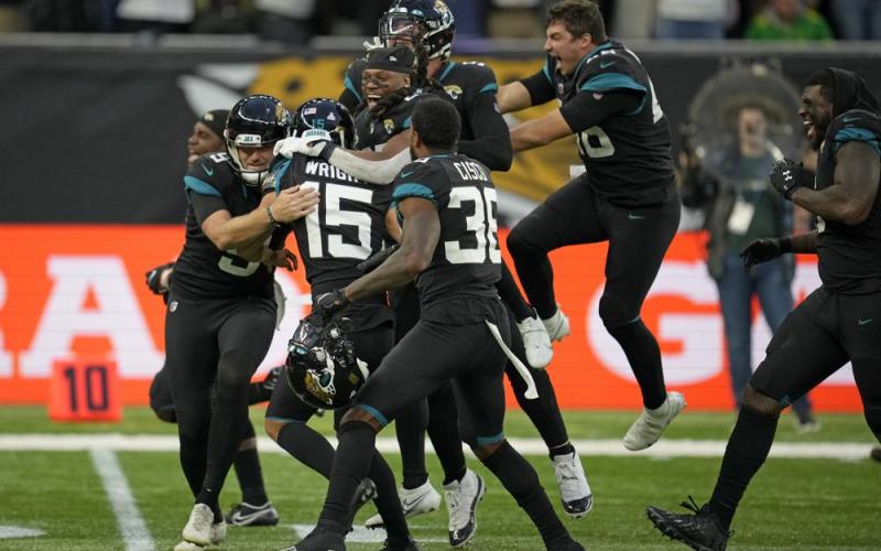 Jacksonville Jaguars kicker Matthew Wright  (center) celebrates after kicking a game-winning field goal to defeat the Miami Dolphins at the Tottenham Hotspur stadium in Oct. 17 in London, England. (MATT DUNHAM/Associated Press)