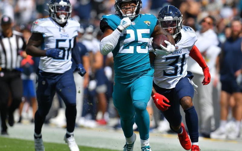 Jacksonville Jaguars running back James Robinson eludes Titans defenders on a long second-quarter run to the 12-yard line during first quarter action on Oct. 10 in Jacksonville. (TRIBUNE NEWS SERVICE)