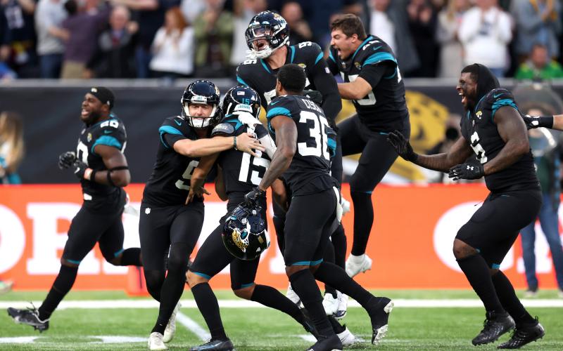 Jacksonville Jaguars kicker Matthew Wright (15) celebrates with teammates after kicking the game-winning field goal against the Miami Dolphins at Tottenham Hotspur Stadium on Oct. 17 in London, England. (ALEX PANTLING/Getty Images/TNS)