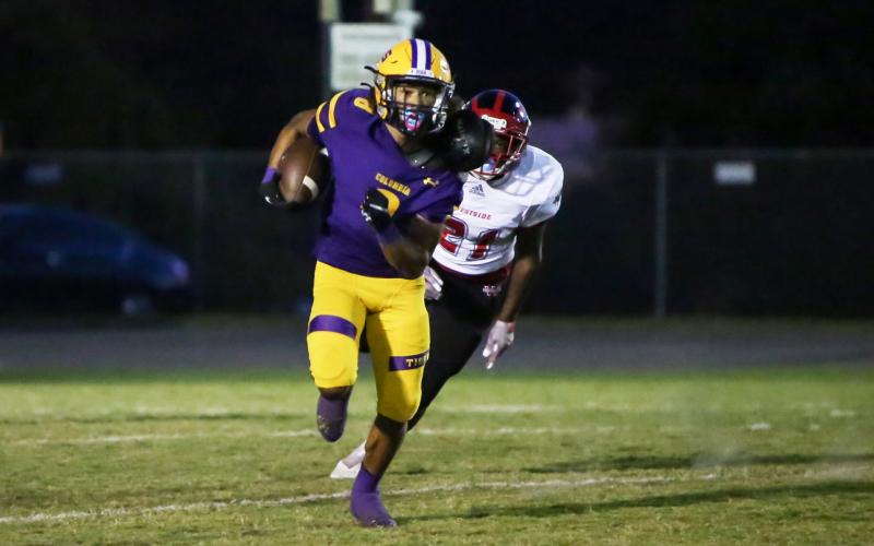 Columbia receiver Jace Hoskey runs up the field on his way to scoring a touchdown against Westside on Oct. 1. (BRENT KUYKENDALL/Lake City Reporter)