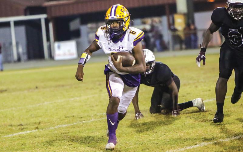 Columbia’s Tray Tolliver looks for room to run Friday against Madison County at Boot Hill Stadium. (BRENT KUYKENDALL/Lake City Reporter)
