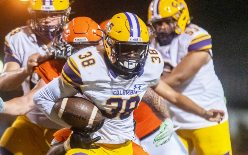 Columbia running back Malik Moore rushes up the field against Orange Park on Friday. (FRAN RUCHALSKI/Special to the Reporter)