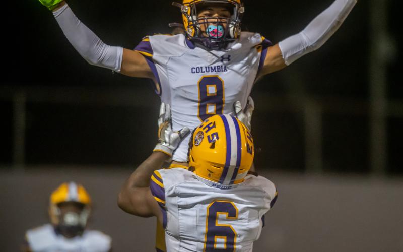 Columbia receiver Jace Hoskey (8) is raised in the air by receiver Tray Tolliver in celebration after Hoskey scored a touchdown against Orange Park on Oct. 15. (FRAN RUCHALSKI/Special to the Reporter)