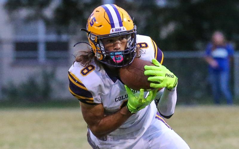 Columbia receiver Jace Hoskey pulls in a catch against Riverside on Oct. 8. (GARY LLOYD MCCULLOUGH/Special to the Reporter)