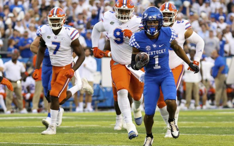 Kentucky wide receiver Wan'Dale Robinson (1) runs for a touchdown against Florida on Oct. 2 in Lexington, Ky. (MICHAEL CLUBB/Associated Press)