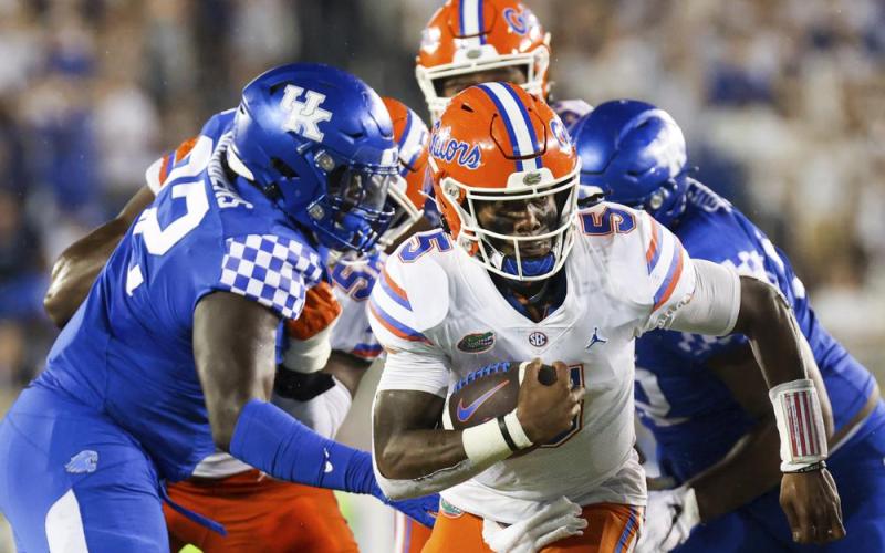 Florida quarterback Emory Jones (5) runs the ball upfield against Kentucky on Oct. 2 in Lexington, Ky. (MICHAEL CLUBB/Associated Press)