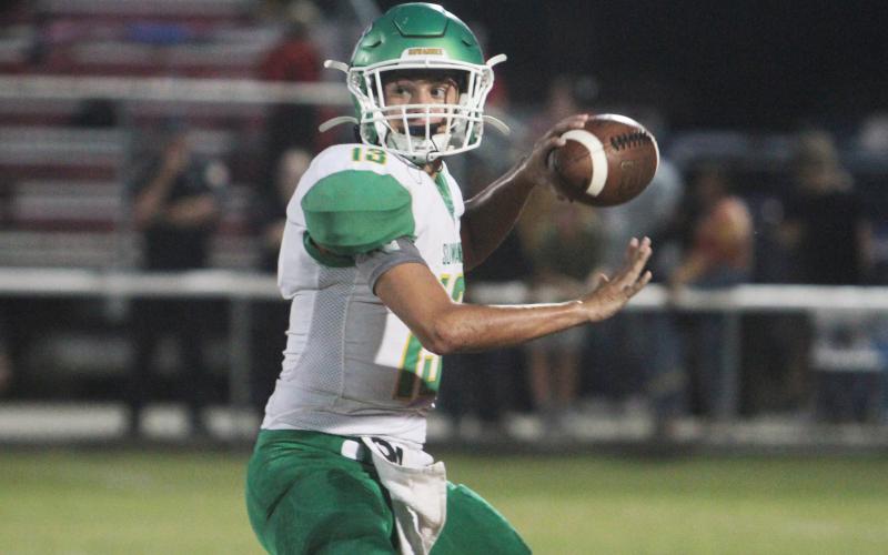 Suwannee quarterback Bronsen Tillotson gets set to throw a pass against Dixie County on Aug. 27. (PAUL BUCHANAN/Special to the Reporter)