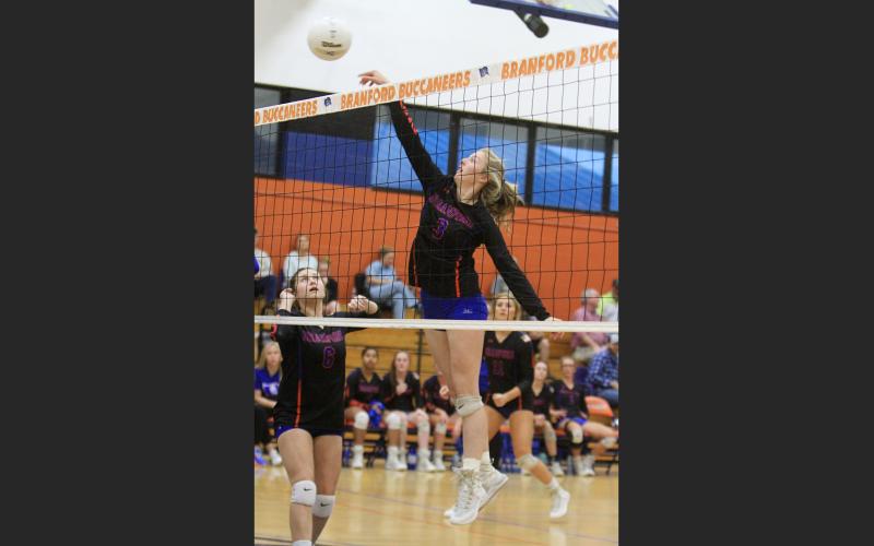 Branford hitter Madyson Sikes sends a shot over the net against Taylor County in the District 5-1A semifinals on Tuesday. (PAUL BUCHANAN/Special to the Reporter)