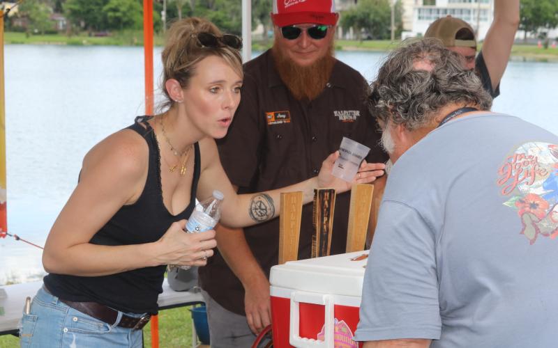 Holly Frazier discusses the options available at Halpatter Brewing Co.’s tent at the 2019 Gateway City Craft Beer and Wine Festival. (FILE)