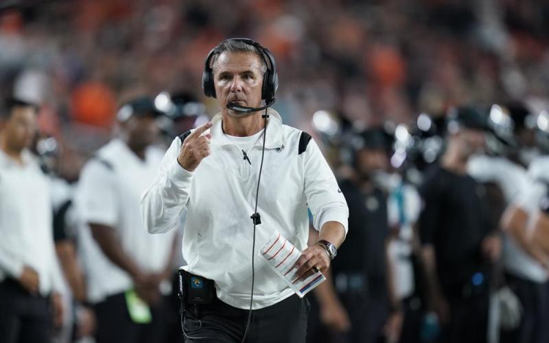 Jacksonville Jaguars head coach Urban Meyer walks with an official during Thursday's game against the Cincinnati Bengals in Cincinnati. (MICHAEL CONROY/Associated Press)