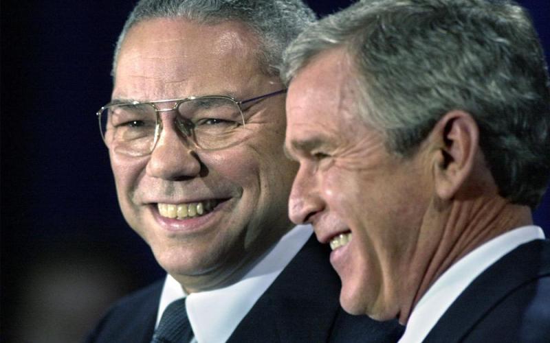 In this Dec. 16, 2000 file photo, President-elect Bush smiles as he introduces retired Gen. Colin Powell (left) as his nominee to be secretary of state during a ceremony in Crawford, Texas. Powell, former Joint Chiefs chairman and secretary of state, has died from covid-19 complications. In an announcement on social media Monday, the family said Powell had been fully vaccinated. He was 84. (DAVID J. PHILLIP/Associated Press)