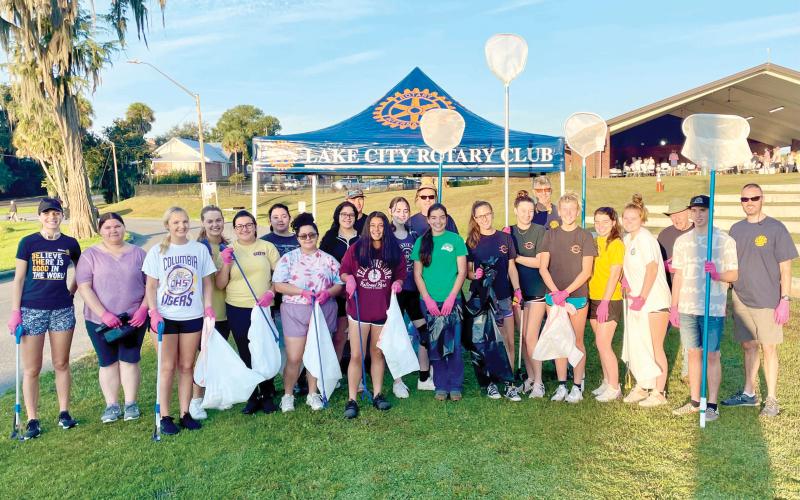 Columbia High School students preparing to pull trash from Lake DeSoto last Saturday as part of the Rotary Club of Lake City - Downtown’s Lake DeSoto Lake Clean-Up event. (COURTESY)