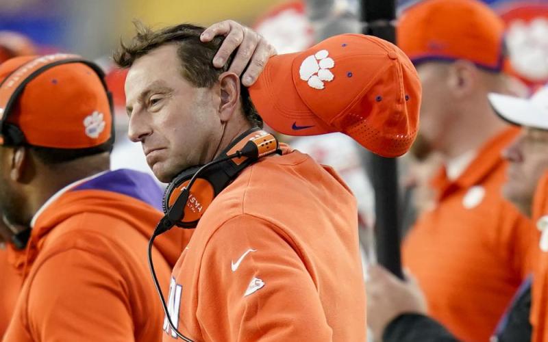 Clemson head coach Dabo Swinney wipes his head as he watches as his team play against Pittsburgh on Oct. 23 in Pittsburgh. Pittsburgh won 27-17. (KEITH SRAKOCIC/Associated Press)