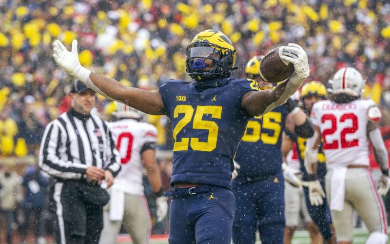 Michigan running back Hassan Haskins (25) celebrates a touchdown against Ohio State on Saturday in Ann Arbor, Mich. Michigan won 42-27. (TONY DING/Associated Press)